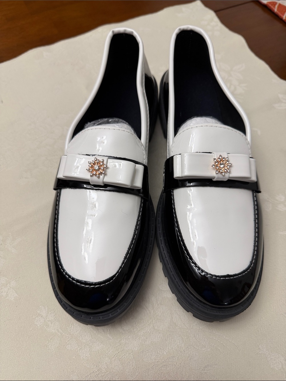 Patent Leather Two-Tone White and Black Loafers with Decorative Accent